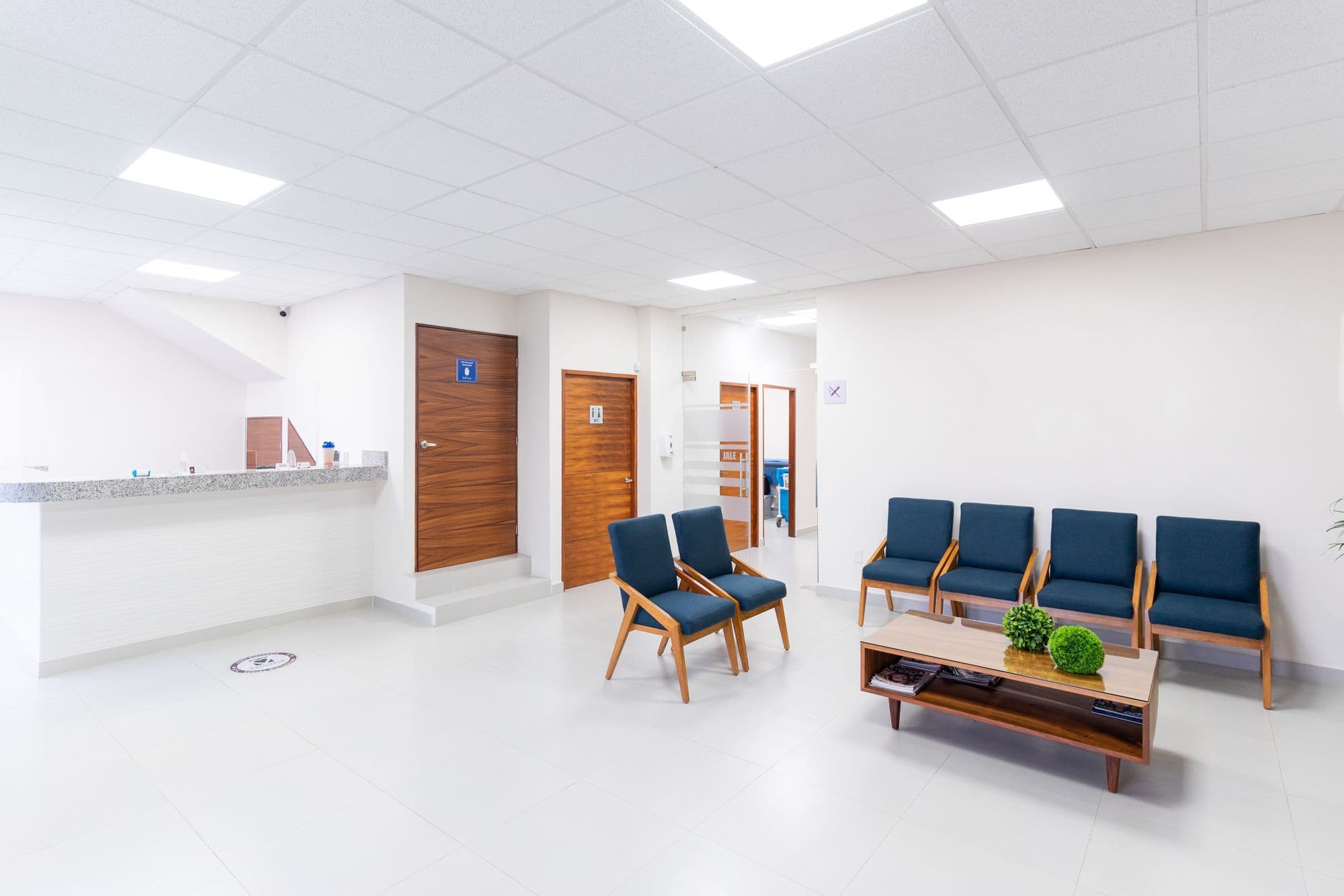 A quiet clinic waiting area with empty chairs